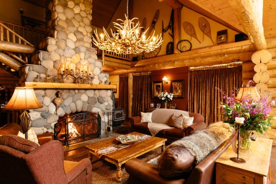 A rustic yet elegant great room is at the cozy heart of this luxury guest ranch